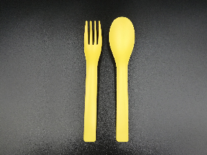 Yellow Plastic spoon and folk